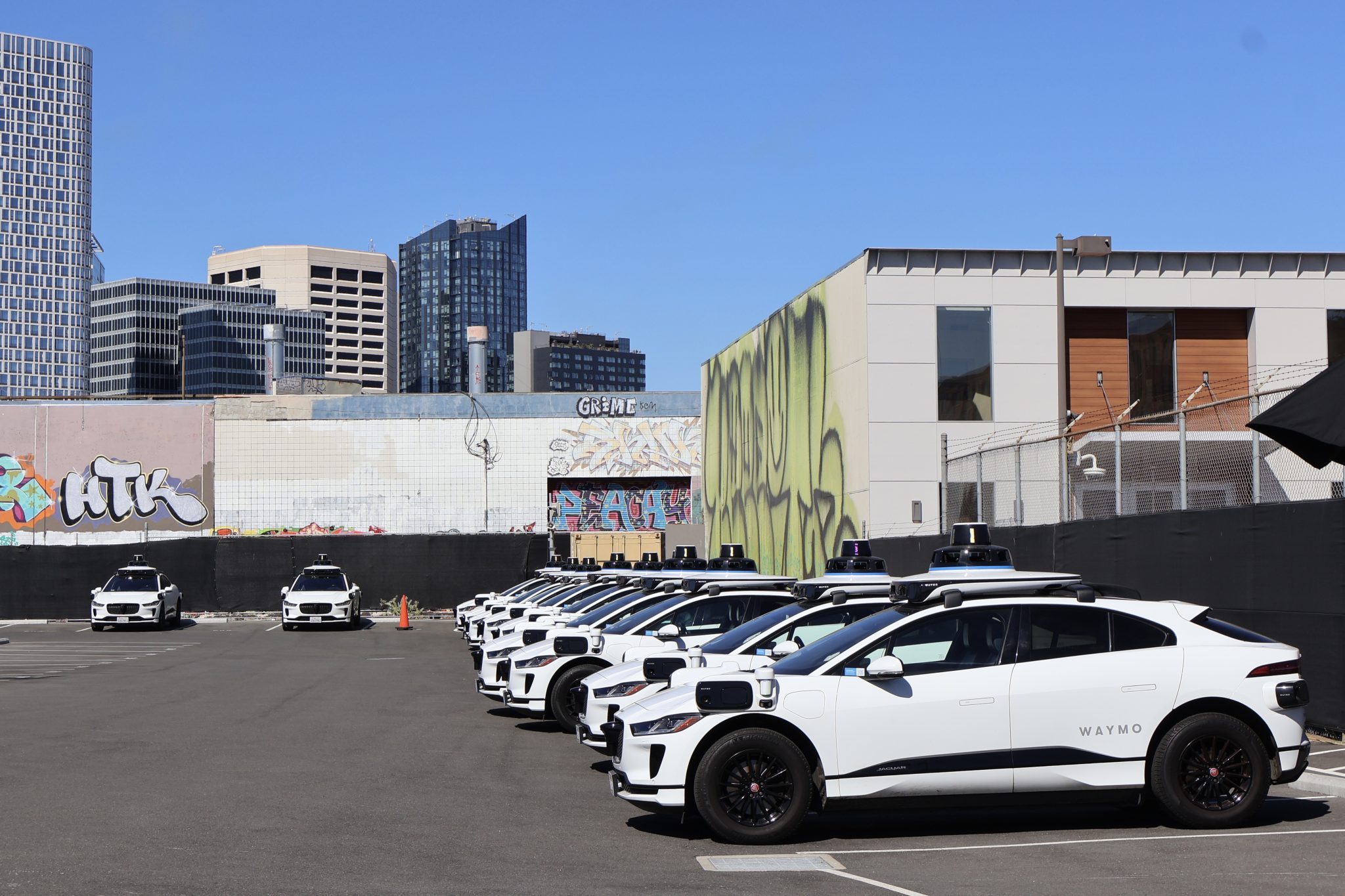 Waymo cars parked in a parking lot