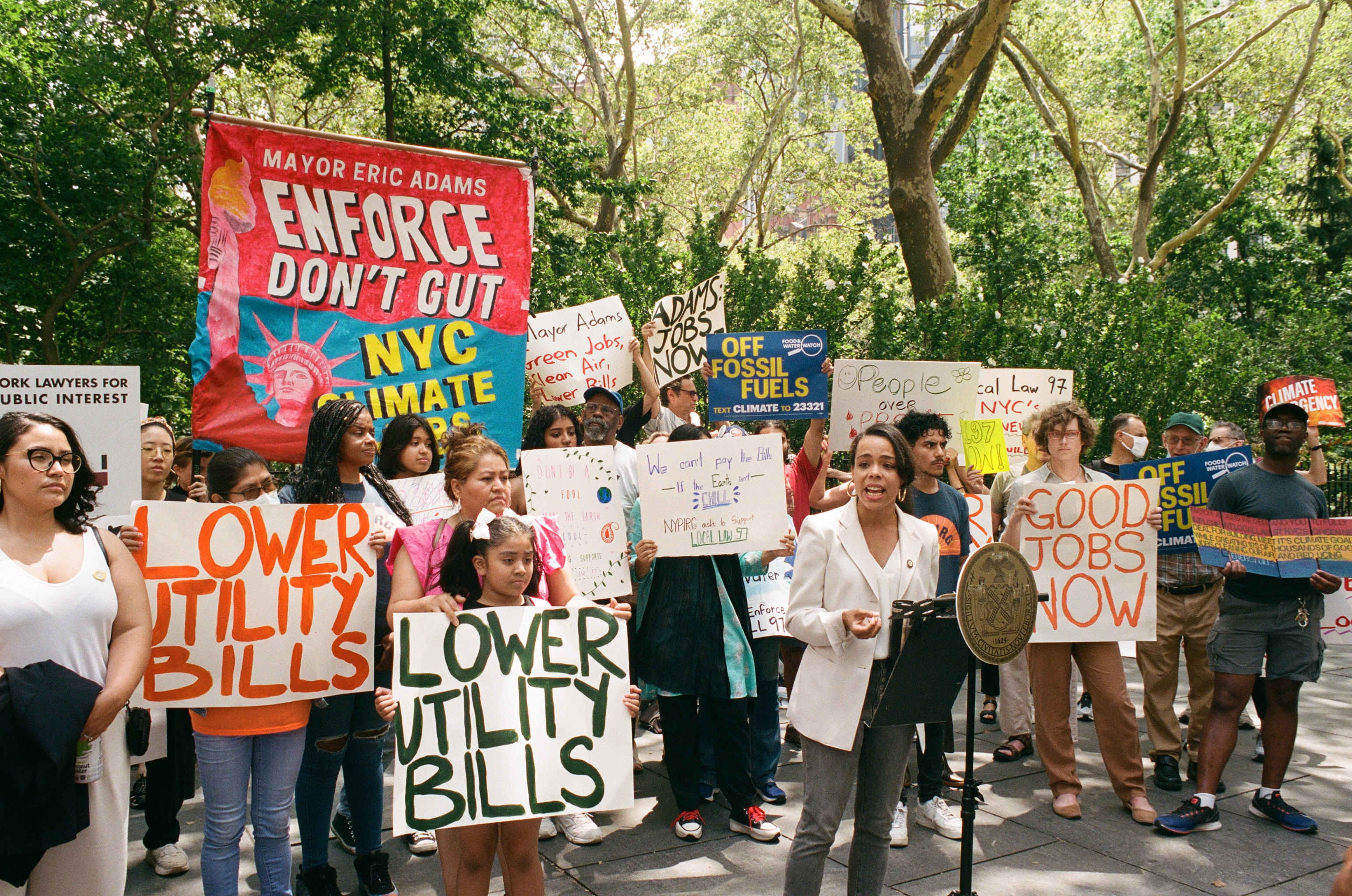 Council Member Pierina Sanchez speaks to climate from podium outside City Hall